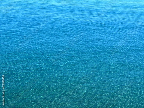 Blue sea water rippled calm surface.
