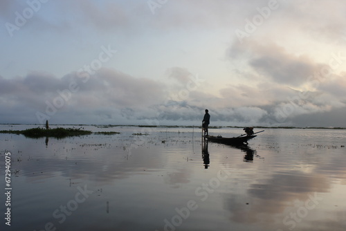 Fisherman in Myanmar  with a stunning blue sky stretching out in the background
