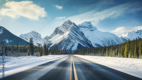Wallpaper Mural Winter highway leading to snowy mountains. Road trip in winter season. Beautiful landscape with mountain ranges Torontodigital.ca