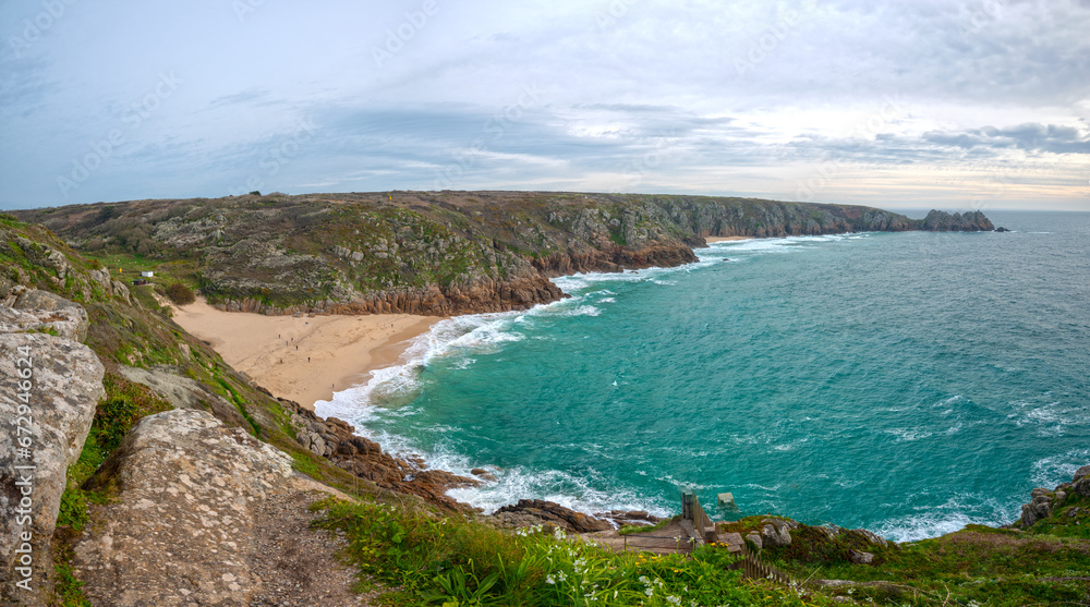 Porthcurno Beach, Cornwall. Picturesque beach featuring turquoise waters & surrounding granite cliffs.