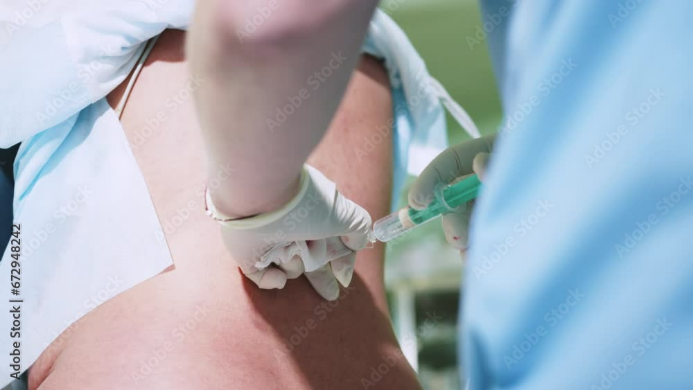 Spinal anesthesia. Doctor anesthesiologist draw syringe medicine, drug ...
