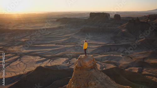 Man watching sunrise at Moonscape Overlook in Utah, USA photo
