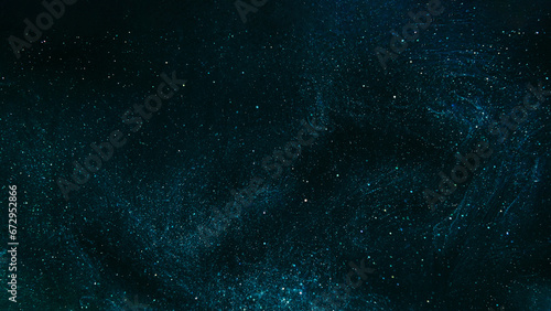 Glitter abstract background. Night stars. Galaxy universe. Teal blue shimmering shiny bokeh sparkles ink flow spreading glowing in black art.