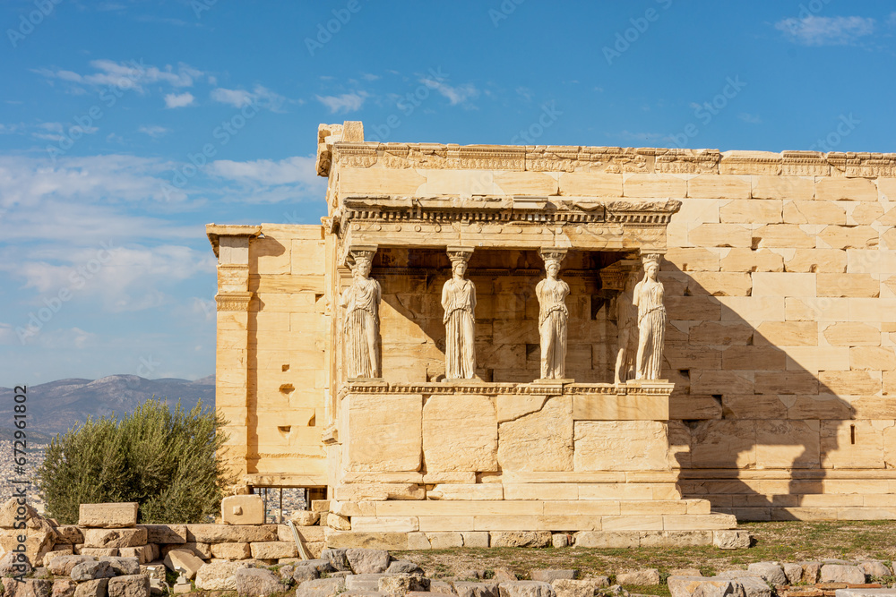 Obraz premium Erechtheion, Erechtheum - ancient Greek temple on Acropolis Athens hill, Greece with the Porch of the Maidens (Caryatid Porch) sculptures
