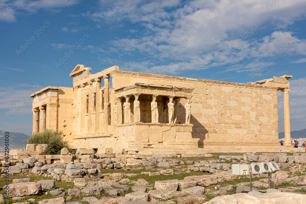 Obraz premium Erechtheion, Erechtheum - ancient Greek temple on Acropolis Athens hill, Greece with the Porch of the Maidens (Caryatid Porch) sculptures