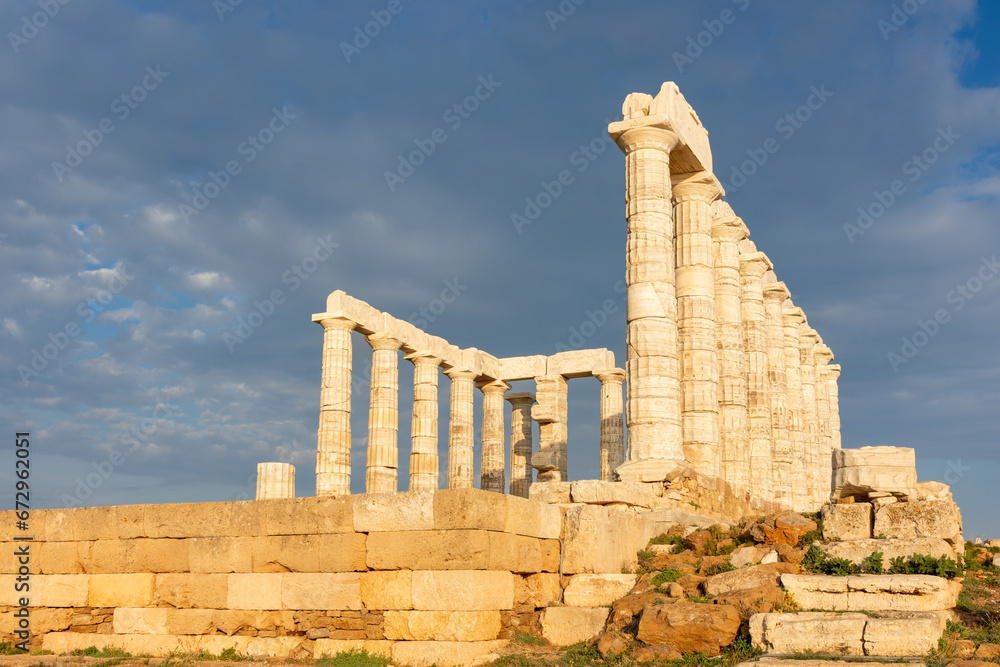 Fototapeta premium The Temple of Poseidon on Cape Sounion, Attica, Greece - ancient stone temple with Doric columns