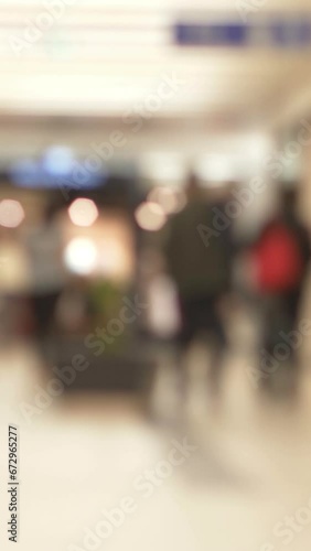 Wallpaper Mural Blurred People Inside City Mall vertical video Torontodigital.ca