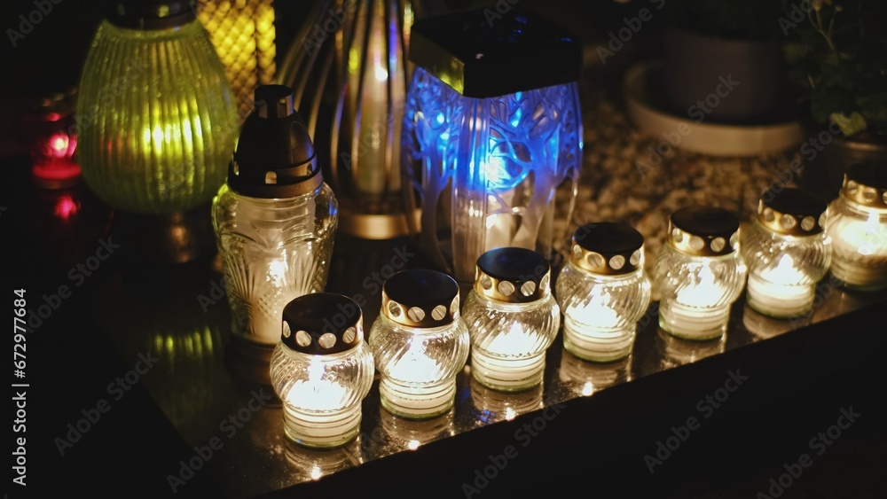 Cemetery Grave Tombstone Decorated with Candle Lanterns on All Saints Day Evening Cemetery Grave Tombstone Decorated with Candle Lanterns on All Saints Day Evening
