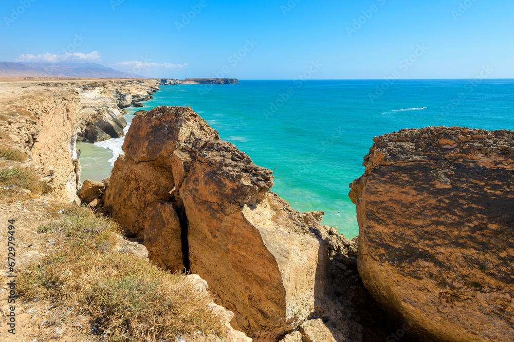The rugged coastline along the Arabian Sea near Mughsail Beach in Salalah Oman. The rugged coastline along the Arabian Sea near Mughsail Beach in Salalah Oman.