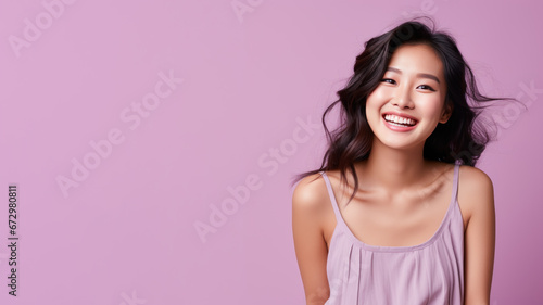 Asian woman model wear a purple sundress isolated on pastel background © pariketan