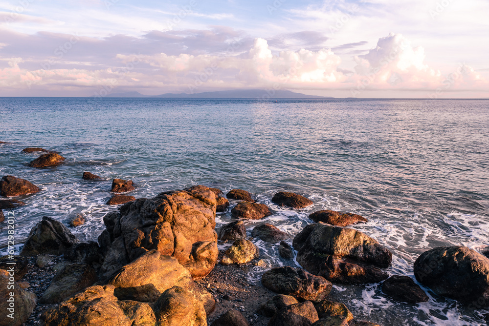 Scenic rock formation during sunrise at the beach of Mindoro, Philippines Scenic rock formation during sunrise at the beach of Mindoro, Philippines