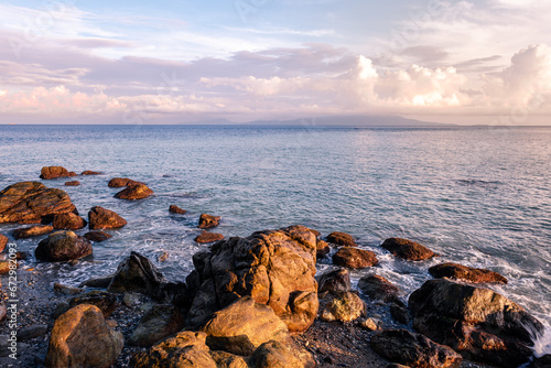 Scenic rock formation during sunrise at the beach of Mindoro, Philippines © leonardovillasis