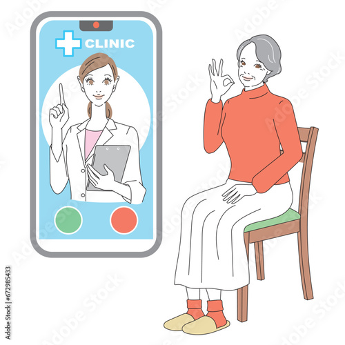 スマートフォンでオンライン診療を受けるシニア女性