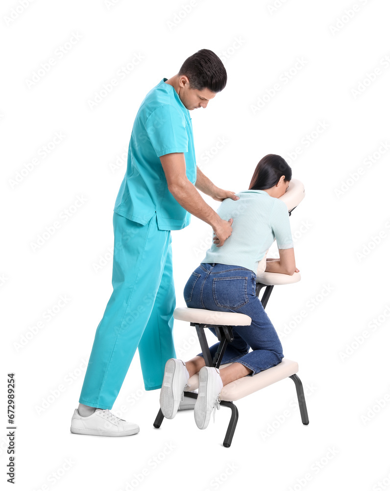 Woman receiving massage in modern chair on white background Woman receiving massage in modern chair on white background