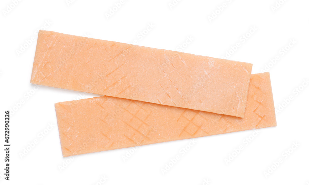Sticks of tasty orange bubble gums isolated on white, top view Sticks of tasty orange bubble gums isolated on white, top view