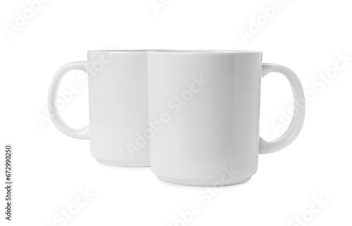 Two light ceramic mugs isolated on white