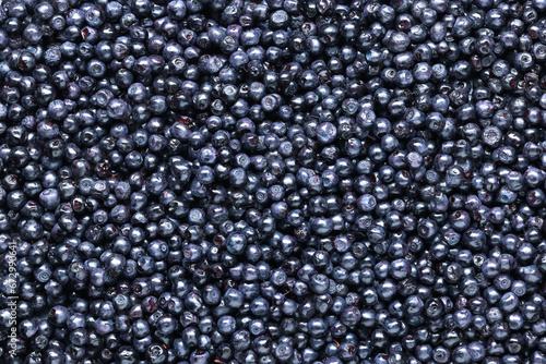 Many tasty fresh bilberries as background, top view