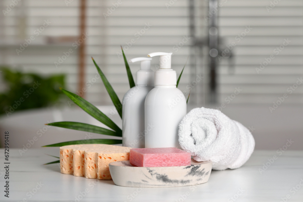 Composition with spa products on white marble table indoors