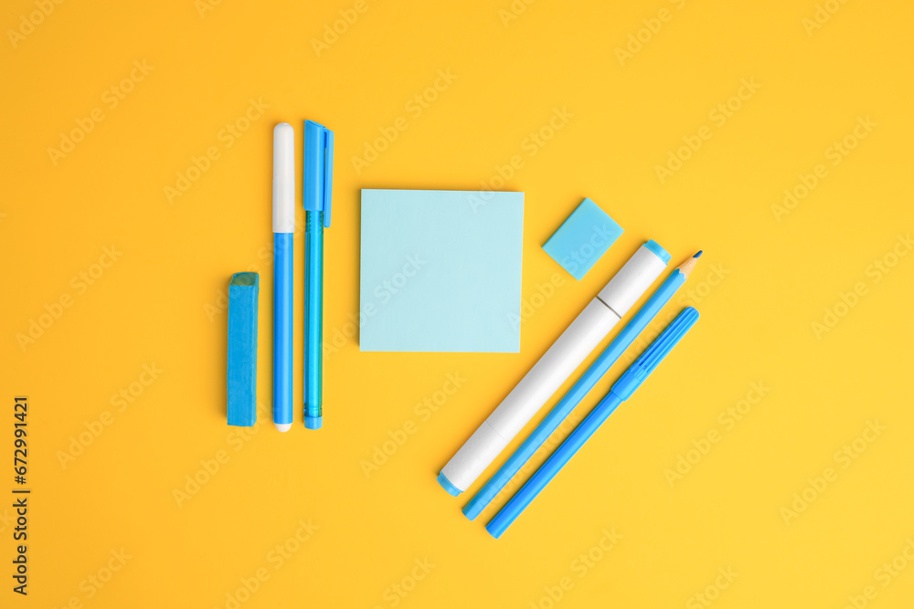 Obraz premium Flat lay composition with different school stationery on yellow background, space for text. Back to school