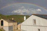 rainbow over the houses