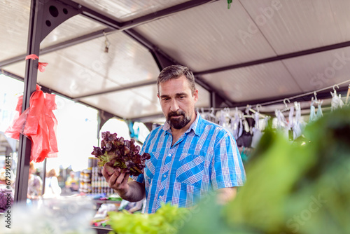 Man buying vegetables © Jelena