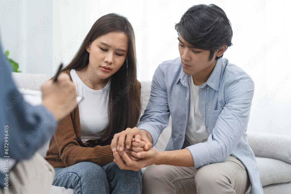 couple relationship therapy with a counselor. Close Up hands of the woman client during a conversation with psychologist to find problems and solution. couple relationship therapy with a counselor. Close Up hands of the woman client during a conversation with psychologist to find problems and solution.