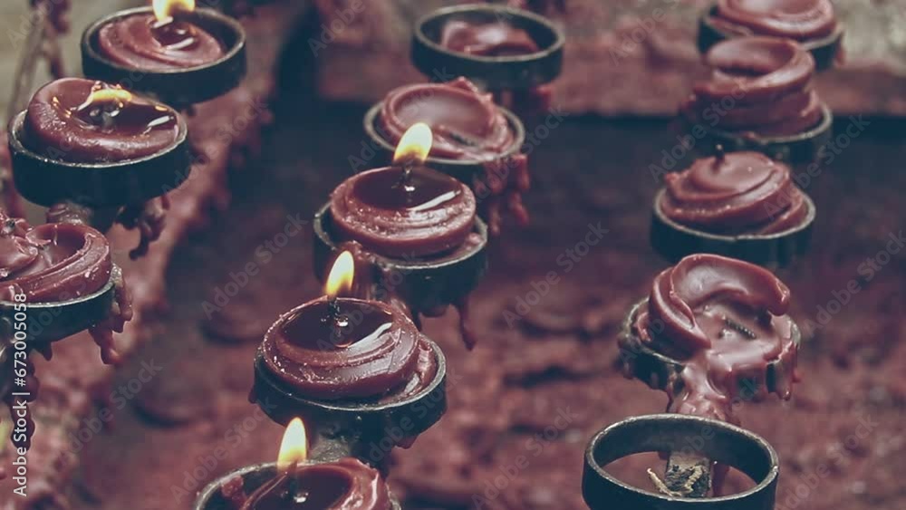 Ambient motion of lit candle offerings during the Lent or Lenten Season