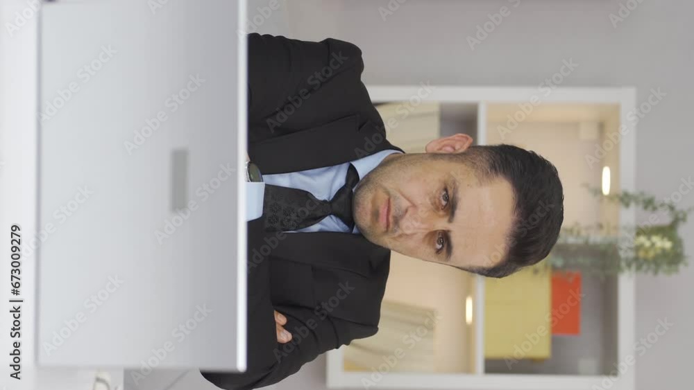 Vertical video of The man working from home gets angry, feels offended and sad. Vertical video of The man working from home gets angry, feels offended and sad.