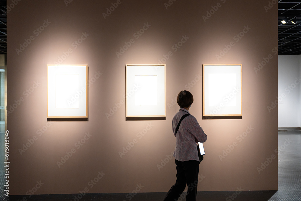 interior of gallery with blank frame interior of gallery with blank frame