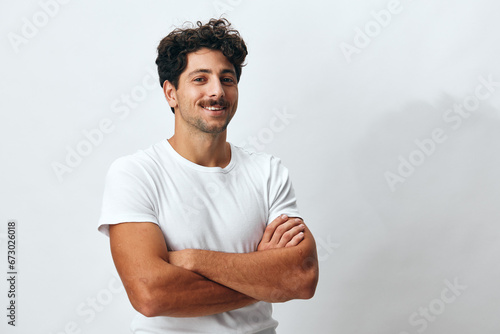 Man lifestyle portrait hipster serious t-shirt isolated person white background american smile confident fashion photo