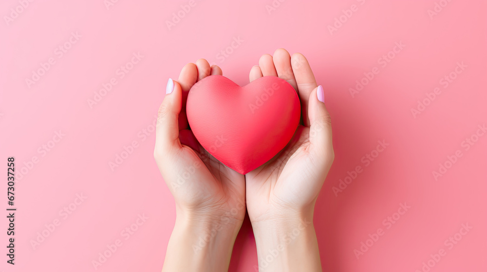 hands holding heart,hands hold a red heart on a pink background, Valentine's day hands holding heart,hands hold a red heart on a pink background, Valentine's day