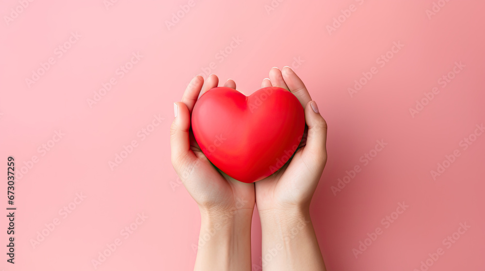 hands holding heart,hands hold a red heart on a pink background, Valentine's day hands holding heart,hands hold a red heart on a pink background, Valentine's day