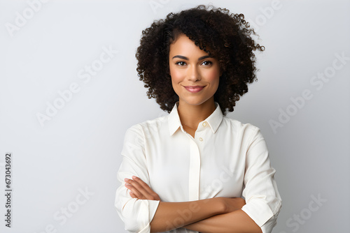 Young African American girl with a smiling portrait, looking at the camera confidently with arms crossed, She stands as a successful businesswoman, exuding happiness, Isolated on a white background,