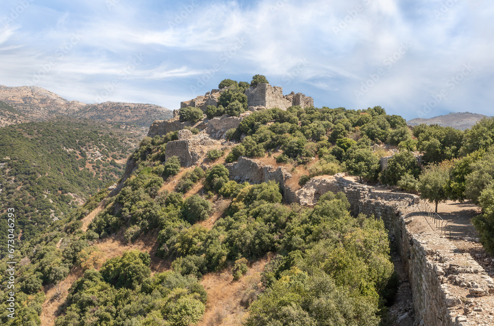 View  from fortress to far walls and towers of the ruins of the medieval fortress of Nimrod - Qalaat al-Subeiba, located near the border with Syria and Lebanon on the Golan Heights, in northern Israel