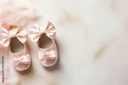 Cute baby shoes for new born girl on light background with space for text photo