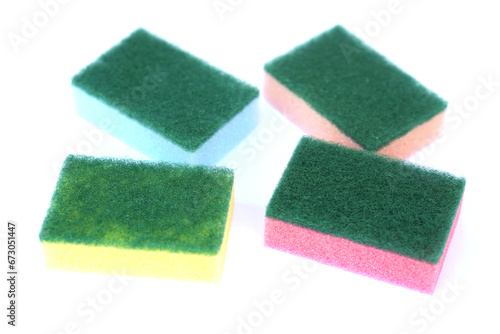 Soft cleaning sponge for washing dishes, isolated in white background. Concept, useful equipment for cleaning, scrubbing dish in kitchen or use for other purposes. Household tool.                     