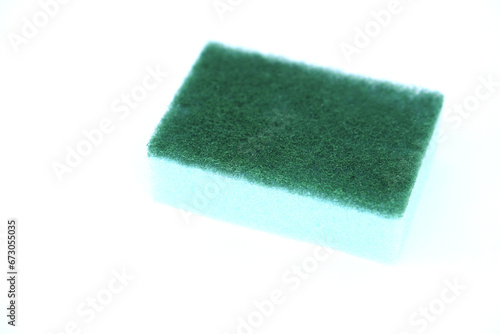 Soft cleaning sponge for washing dishes, isolated in white background. Concept, useful equipment for cleaning, scrubbing dish in kitchen or use for other purposes. Household tool.                     