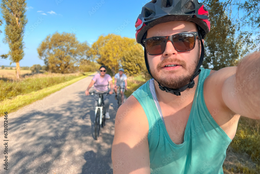 Bikers taking selfie with. smiling friends riding bikes. Biking outdoors with friends. Bonding time. Bikers taking selfie with. smiling friends riding bikes. Biking outdoors with friends. Bonding time.