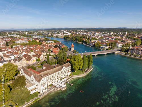 Luftbild vom Bodensee mit dem Seerhein, auch Rheintrichter und der Altstadt von Konstanz, links das Steigenberger Inselhotel, rechts die alte Rheinbrücke photo