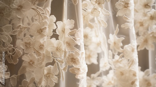 A close-up of intricate lace curtains with delicate floral patterns and lacework photo