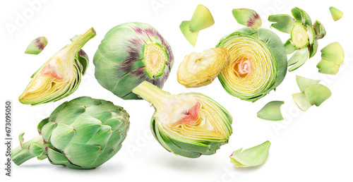 Obraz na płótnie Green french artichoke and artichoke slices flying or levitating in the air on white background