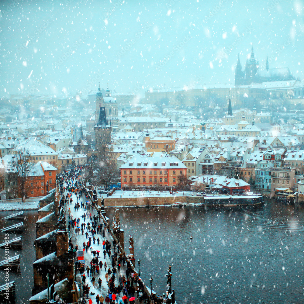 Fototapeta premium Prague at winter time, snow at Charles Bridge