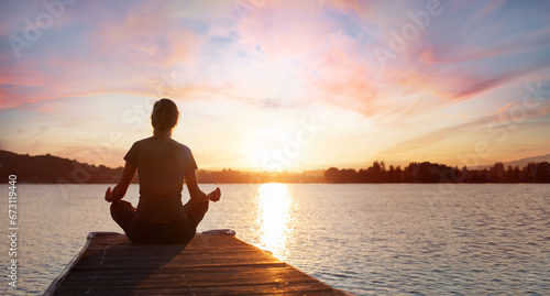 yoga, woman meditating on wooden pier near lake at sunset, meditation and mindfulness banner background with copy space © Song_about_summer
