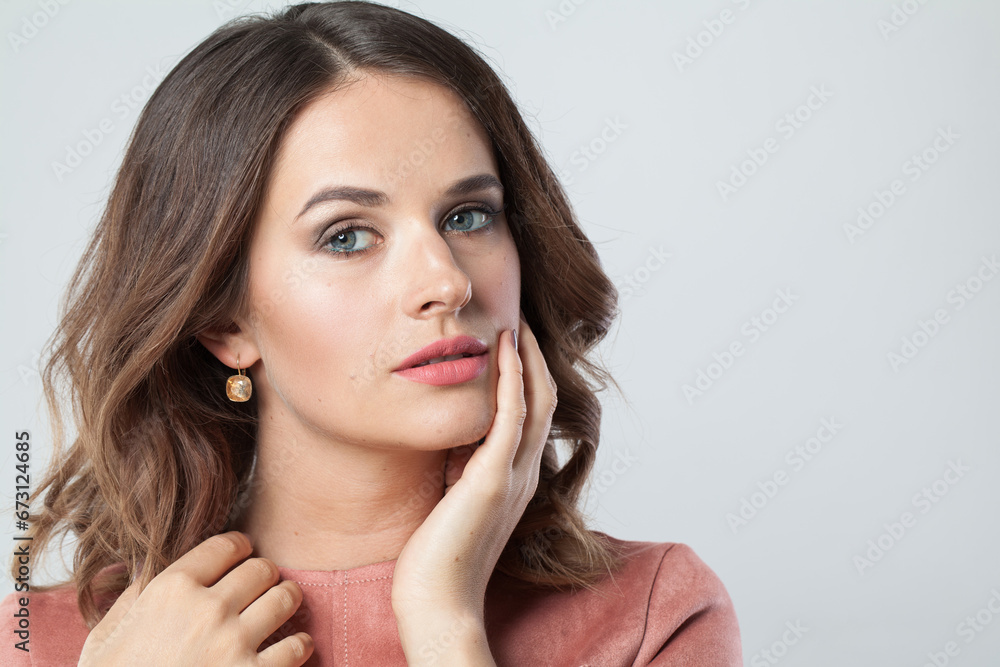 Pretty female face with natural clear skin without retouch. Young perfect brunette woman without retouching, closeup studio portrait Pretty female face with natural clear skin without retouch. Young perfect brunette woman without retouching, closeup studio portrait