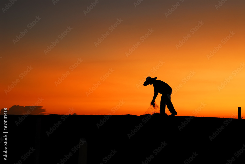 Silhouette model poses during sunset