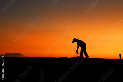 Silhouette model poses during sunset