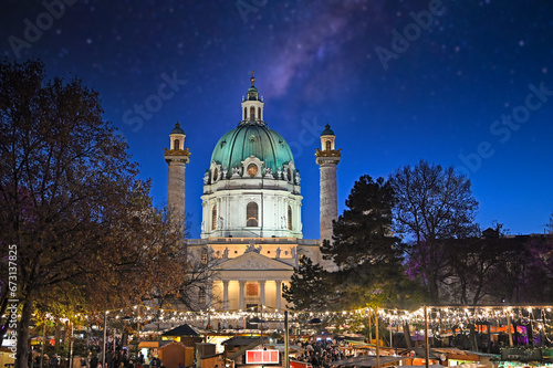 Christmas market on Karlsplatz in Vienna at night photo