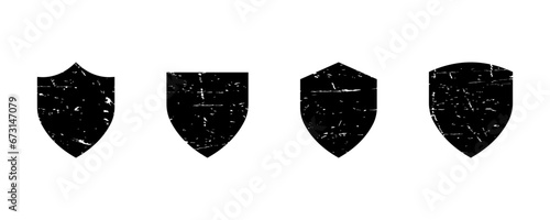 Set of black grunge shields vector icons. Strong, protect or defence icon. Safety symbol. Vector 10 Eps.