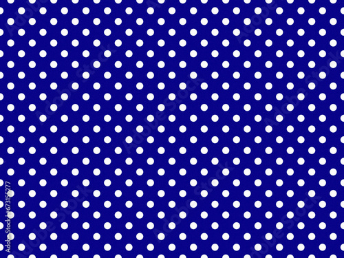 texturised white color polka dots over dark blue background photo