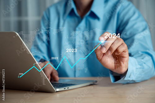 businessman new year business goals 2024, positive indicators 2024 , Planning and challenge strategy business in new year  Concept .